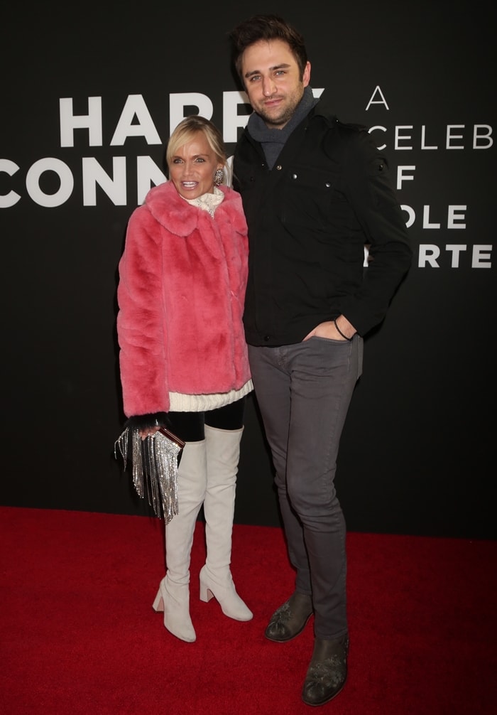 Kristin Chenoweth, accompanied by her musician boyfriend Josh Young, attended the opening night performance of the new Broadway show Harry Connick Jr. – A Celebration of Cole Porter at the Nederlander Theatre in New York City on December 12, 2019, where she sported a vibrant pink faux fur coat, white over-the-knee boots, and a metallic fringe handbag
