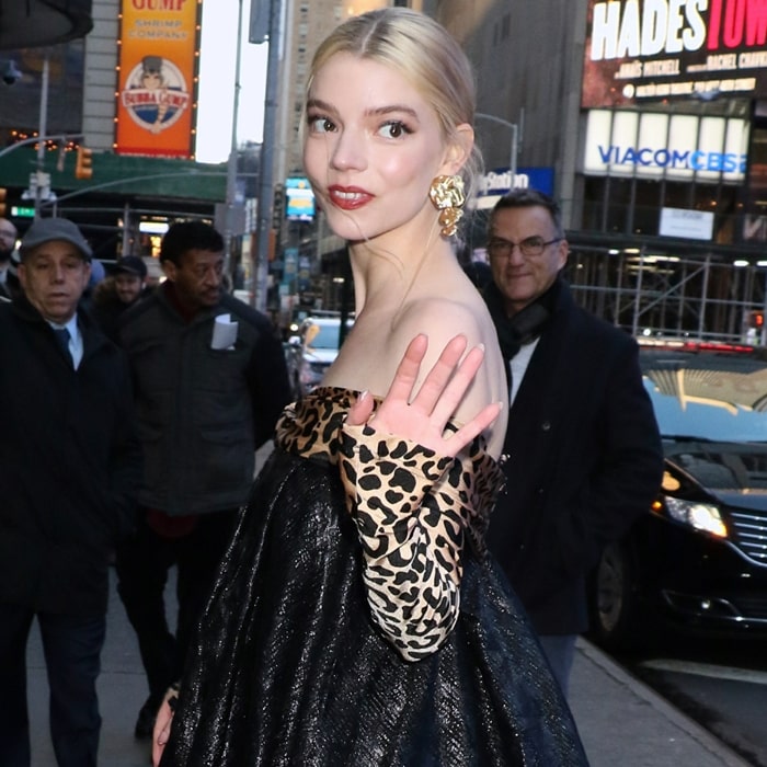 Anya Taylor-Joy greets onlookers outside Good Morning America during the press tour for her 2020 film Emma