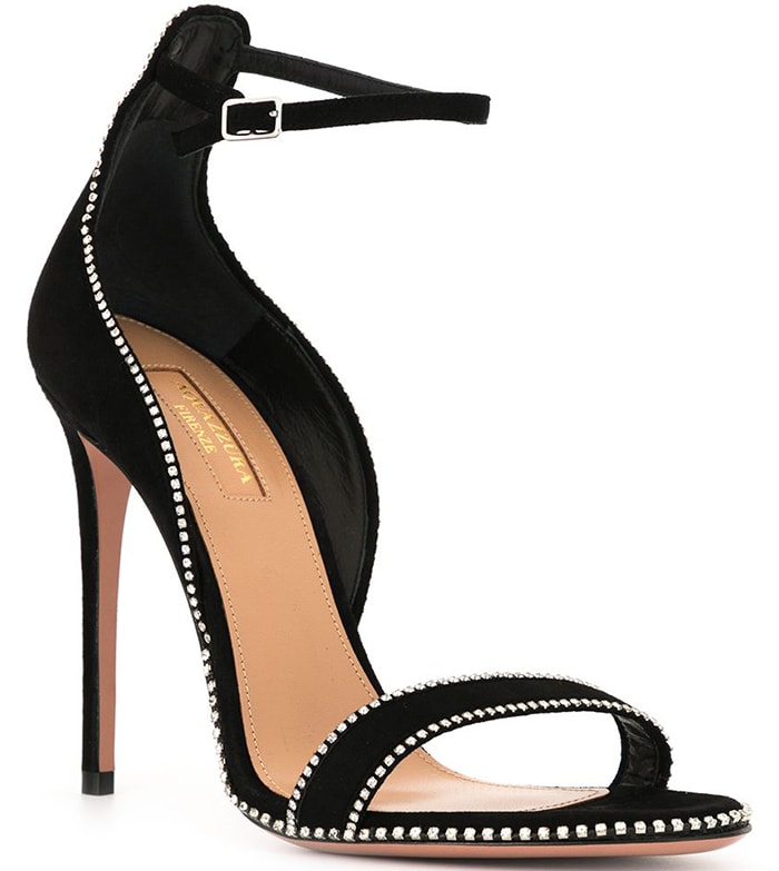Aquazzura's crystal-trimmed sandal silhouette pairs minimalist lines with delicate embellishment inspired by the brand's signature evening aesthetic