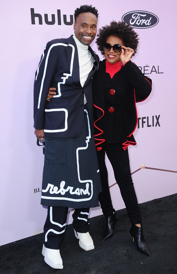 Billy Porter attended the 2020 Essence Black Women in Hollywood Luncheon with Jenifer Lewis at the Beverly Wilshire, pairing his graphic Official Rebrand suit with sculptural white ankle boots that reinforced his reputation for architectural, shoe-led styling