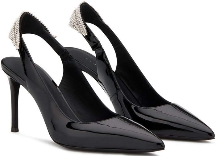Giuseppe Zanotti “Susie” slingback pumps in black patent leather feature a sharply pointed toe and a crystal-embellished heel strap that contrasts sleek minimalism with a hint of sparkle