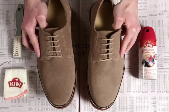 Kiwi shoe care essentials for suede and nubuck: brush, cleaning cloth, and Stain Rain Protector spray