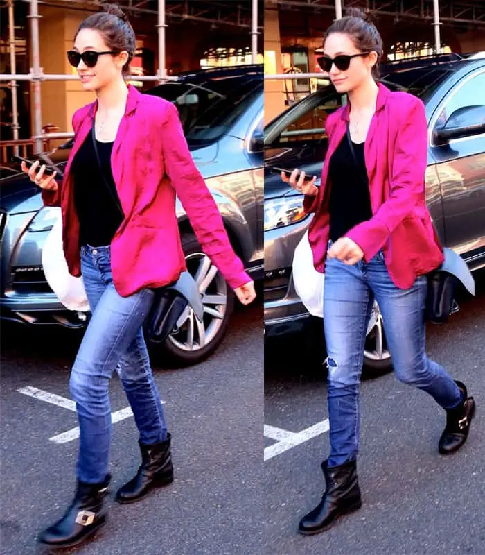Emmy Rossum adds a bold twist to casual denim by pairing black biker boots with a bright pink blazer—proving edgy and vibrant can go hand in hand for errand-day style