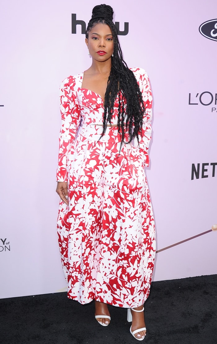 Gabrielle Union attended the 2020 Essence Black Women in Hollywood Awards Luncheon wearing a red-and-white floral Rosie Assoulin silk midi skirt paired with crisp white ankle-strap heels