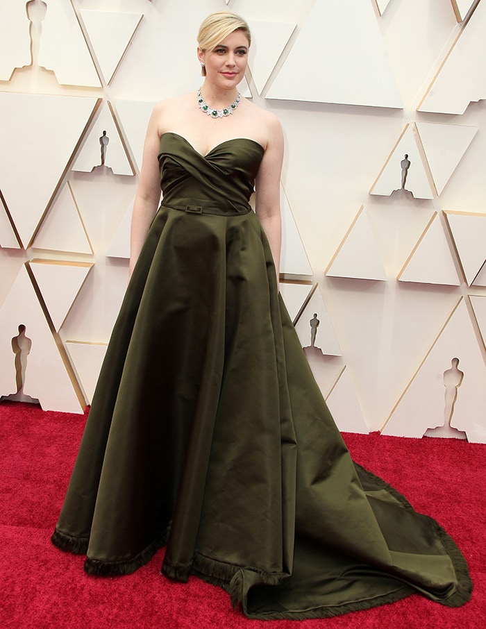 Greta Gerwig stuns on the red carpet in a strapless olive-green Dior Haute Couture gown that channels timeless Old Hollywood glamour at the 92nd Annual Academy Awards in Los Angeles