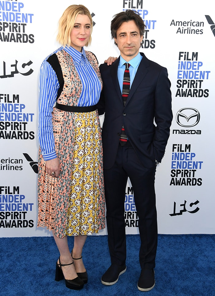 Greta Gerwig embraces playful sophistication in a patchwork Prada Resort 2020 dress alongside Noah Baumbach at the 2020 Film Independent Spirit Awards in Santa Monica