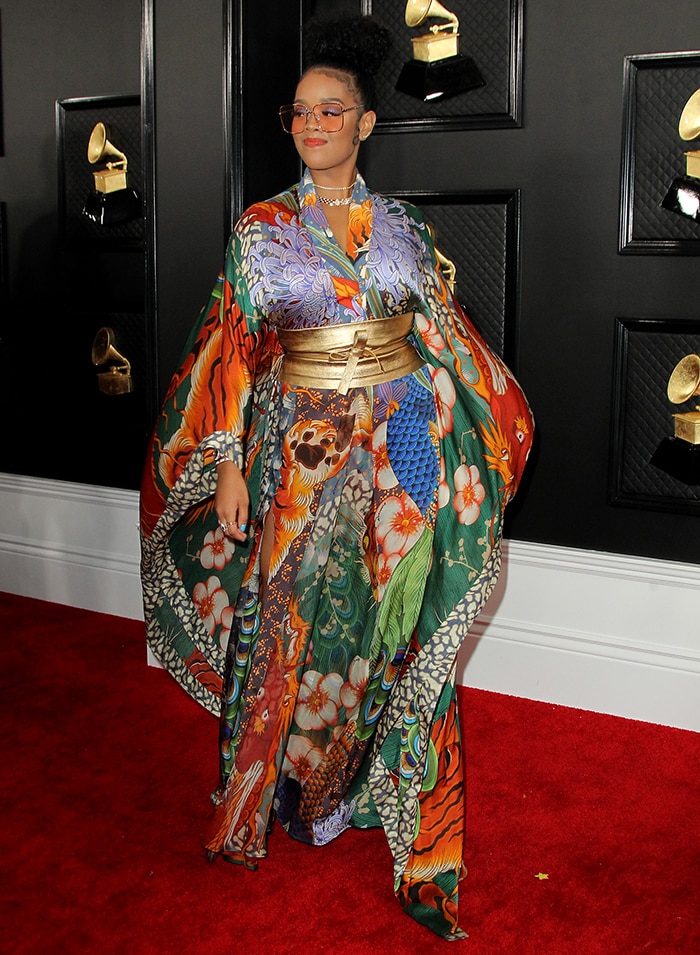 H.E.R. steps out in a vibrant Dsquared2 kimono-inspired dress with bold prints and a structured gold obi belt