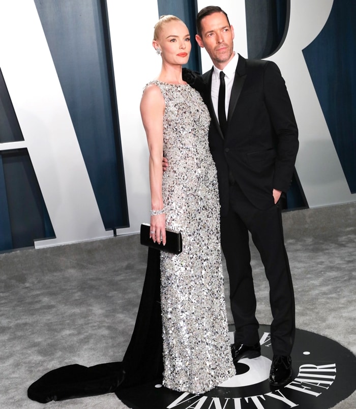 Kate Bosworth attends the 2020 Vanity Fair Oscar Party with Michael Polish in a shimmering Ralph Russo Spring 2019 Couture gown, styled with Jimmy Choo Thyra crystal sandals, a Jimmy Choo Leonis clutch, and a dramatic black velvet train