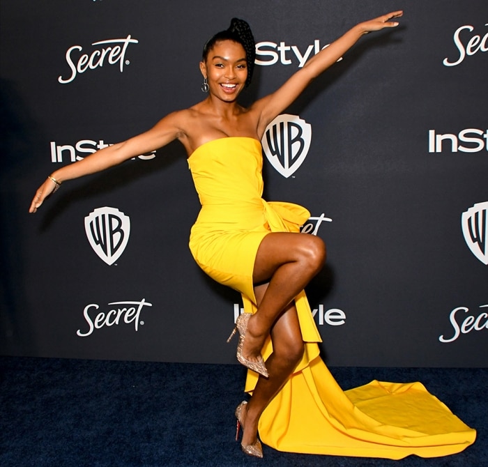 Yara Shahidi radiates confidence in a vibrant yellow Carolina Herrera cascading crepe mini dress and sparkly Christian Louboutin heels at the 2020 Golden Globes After-Party
