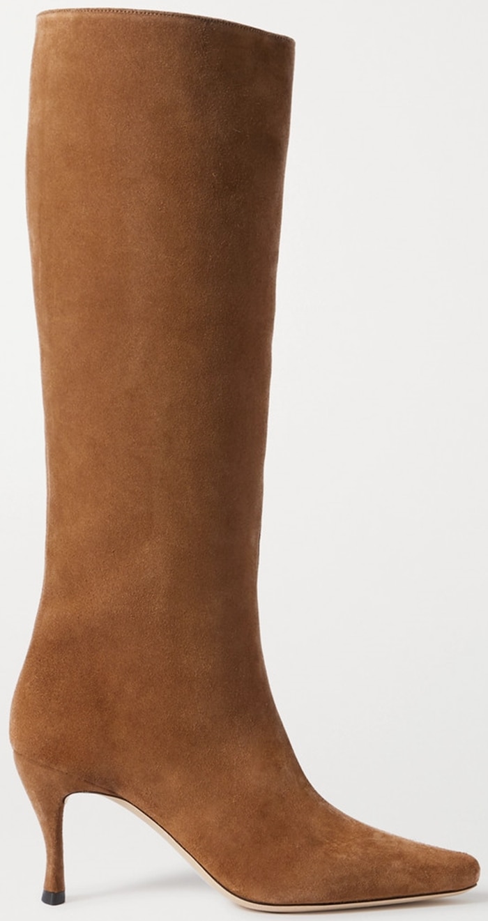 The BY FAR Stevie 42 knee-high boots pair supple brown suede with a slim pointed toe and the label's signature sculptural curved heel, a design that became one of the brand's defining footwear silhouettes