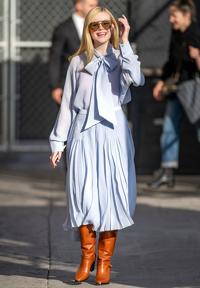 Elle Fanning pairs her silk-chiffon Rochas pussy-bow blouse with Gucci tortoise-framed sunglasses for a sophisticated appearance in Los Angeles