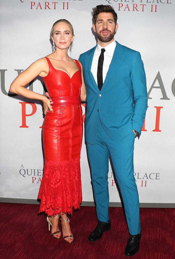 Emily Blunt attended the New York premiere of A Quiet Place Part II on March 8, 2020, alongside husband John Krasinski in a red Alexander McQueen leather midi dress, completing the look with metallic gold Jimmy Choo Misty sandals and a matching Cloud minaudière