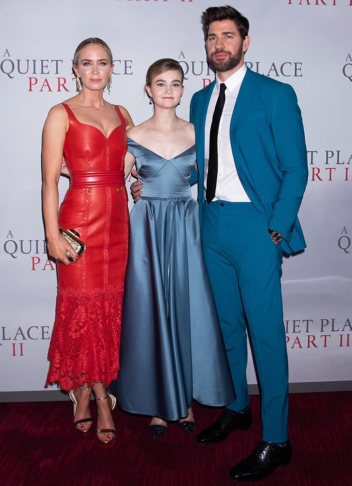 Emily Blunt joined co-stars Millicent Simmonds and John Krasinski at the New York premiere of A Quiet Place Part II on March 8, 2020, wearing a red Alexander McQueen leather midi dress with metallic gold Jimmy Choo Misty sandals and a matching Cloud minaudière