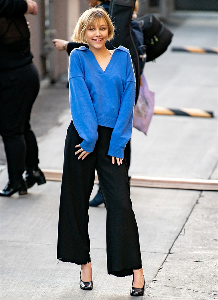 Grace VanderWaal steps out for her Jimmy Kimmel Live! appearance on March 11, 2020, wearing a relaxed blue V-neck sweater and wide-leg black trousers, finished with polished black Chanel pumps
