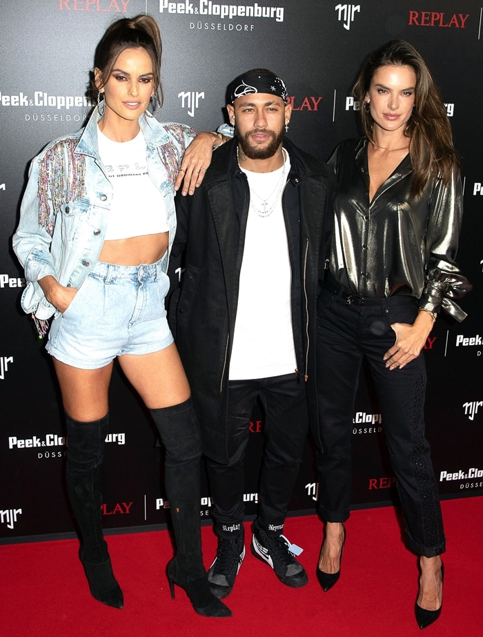 Izabel Goulart, Neymar Jr., and Alessandra Ambrosio bring serious style to the Neymar Jr. x Replay launch, with Alessandra turning heads in sleek Alevi Milano heels at Weltstadthaus