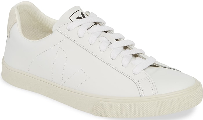 The Veja Esplar’s streamlined court silhouette and tonal white finish explain why the low-top works so naturally with Emily’s neutral tailoring