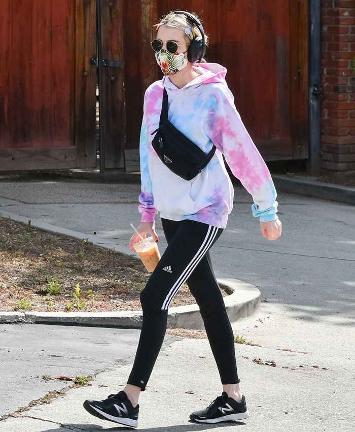 Emma Roberts wearing Adidas soccer pants and New Balance Fresh Foam Zante V2 sneakers while going on a coffee run