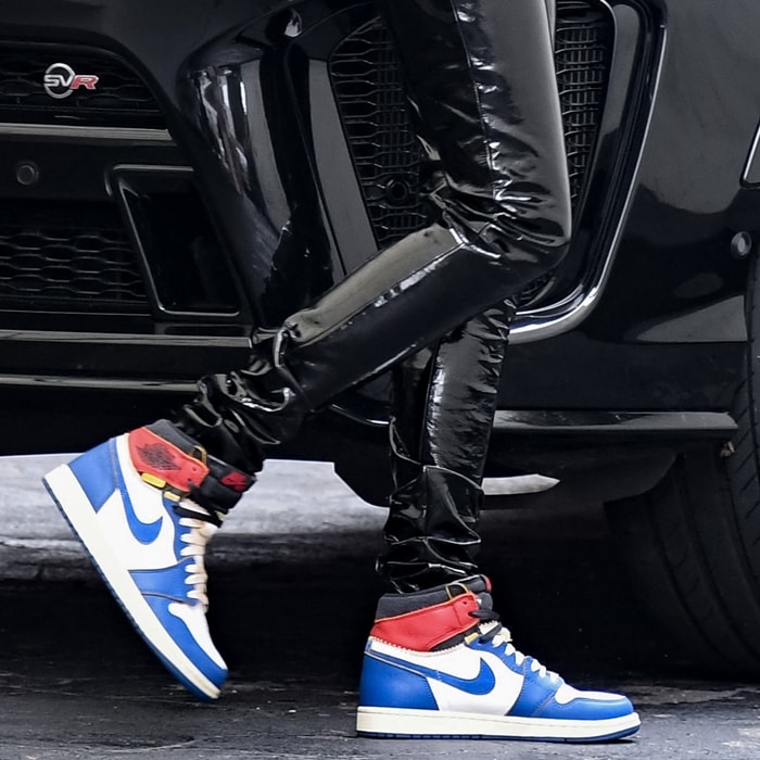 The Union Los Angeles x Air Jordan 1 “Blue Toe” sneakers brought a flash of vintage-inspired color and streetwear credibility to Hailey Bieber’s sharply streamlined latex look