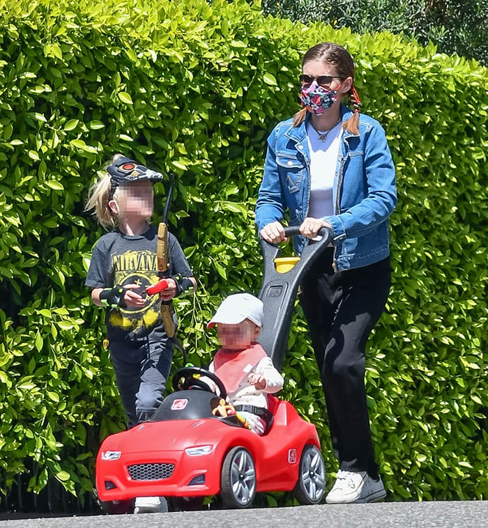 Kate Mara stepped out in Los Feliz on May 22, 2020, pairing black-and-white Converse Chuck Taylor sneakers with relaxed black trousers and a denim jacket, the low-profile canvas shoes lending an easy, functional finish to her off-duty look as she strolled with her daughter and stepson, Jack Matfin Bell