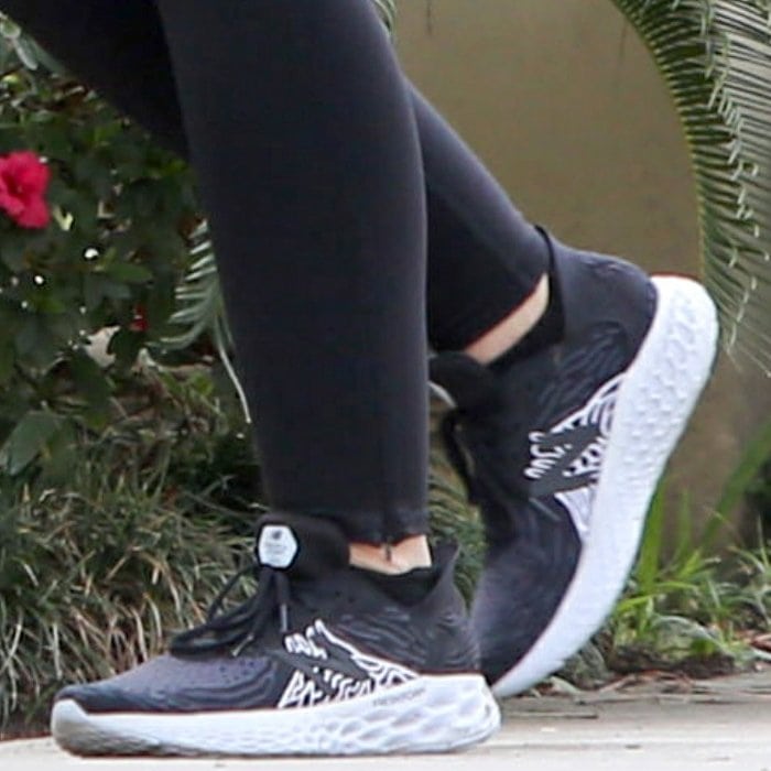 Katherine Schwarzenegger completed her pregnancy walking look with New Balance Fresh Foam 1080v10 sneakers in the Black with Outerspace colorway