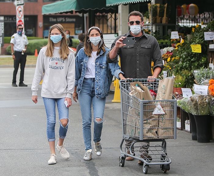 Ben Affleck shops at Whole Foods with Ana de Armas and daughter Violet Affleck in Brentwood, Los Angeles, as the two women coordinate in ripped jeans and low-top sneakers, with de Armas adding distressed Golden Goose Super-Stars to her double-denim look