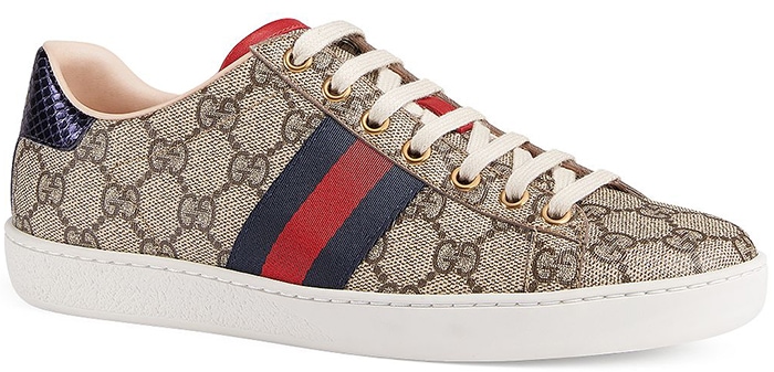 The Gucci New Ace GG Supreme sneakers pair the house’s iconic monogram canvas with signature Web stripes, metallic heel tabs, and a clean low-top silhouette that blends retro tennis styling with everyday luxury