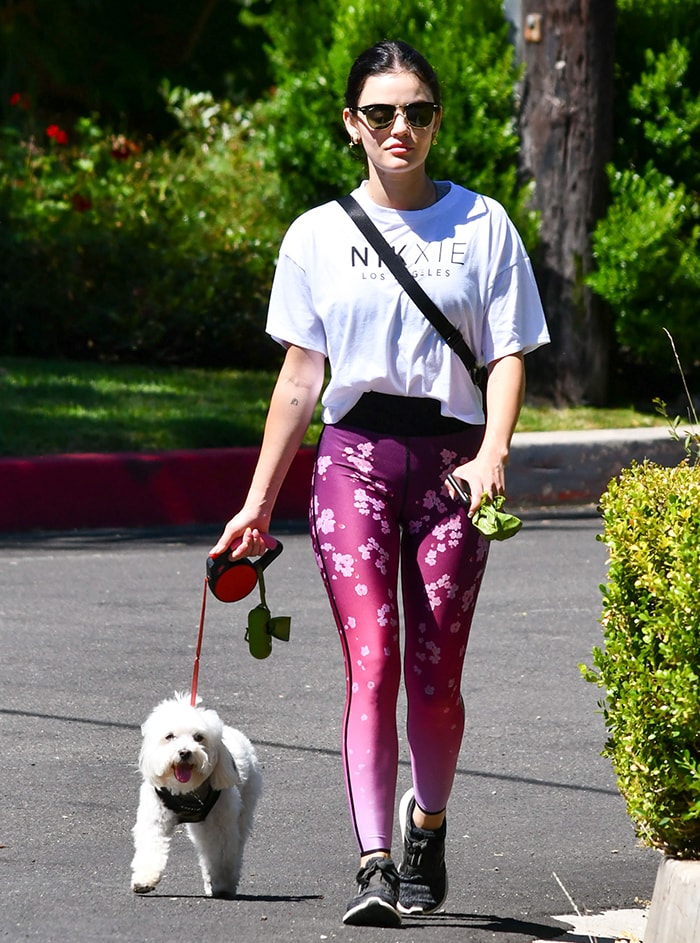 Lucy Hale wears Adidas Edge Lux 3 running shoes with Ultracor cherry blossom leggings while walking her dog, Elvis, in Los Angeles on June 7, 2020