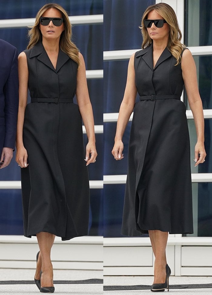 Melania Trump wearing a tailored black Dior sleeveless coat dress styled with her signature black Manolo Blahnik “BB” pointed-toe pumps