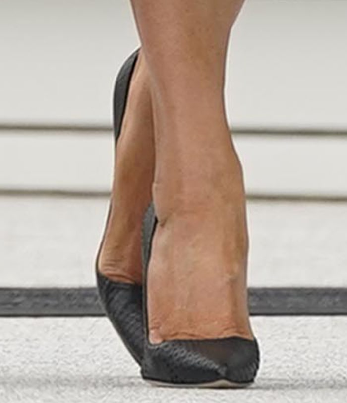Melania Trump shows off her feet in classic black Manolo Blahnik “BB” pumps, the timeless pointed-toe stilettos set on slender 4-inch heels that have become a signature part of her wardrobe