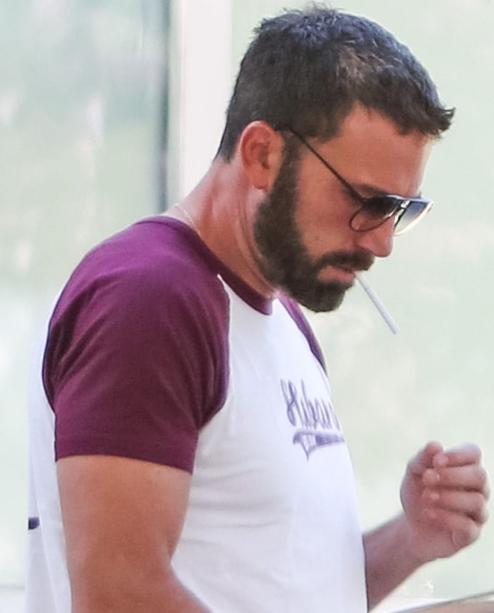 Ben Affleck, deep in thought, seems to be attempting the impossible—lighting a cigarette with sheer willpower and an empty hand