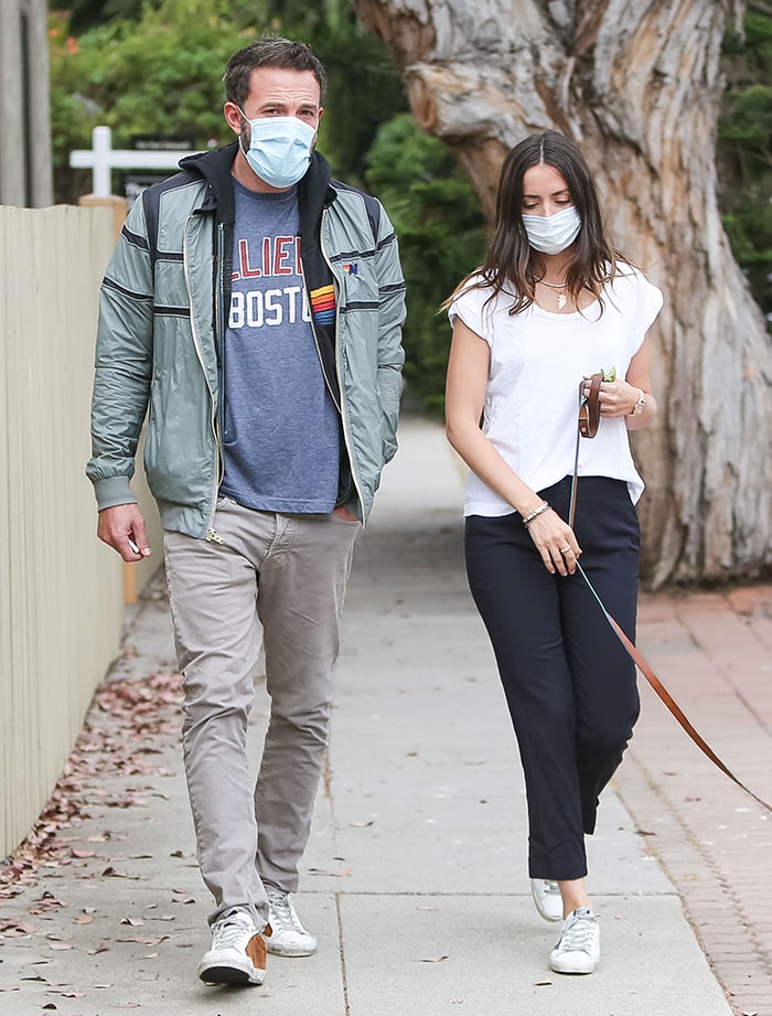 Ana de Armas and Ben Affleck coordinate casual sneaker looks while walking Elvis through their Los Angeles neighborhood