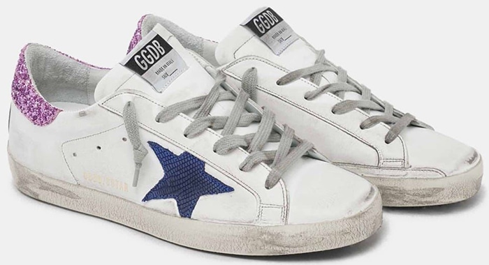 A closer look at the Golden Goose Superstar colorway worn by Ana de Armas, distinguished by its blue leather stars and sparkling lilac heel tabs