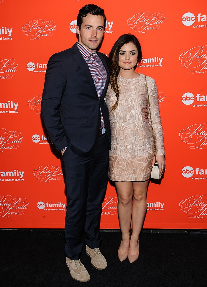Ian Harding and Lucy Hale at the Pretty Little Liars season four finale screening in New York City on March 18, 2014, with Lucy styling nude Valentino metal-heel pumps alongside a python-jacquard Stella McCartney dress and Chloé “Elsie” shoulder bag for a polished red-carpet look