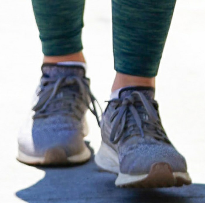 Lucy Hale completed her hiking outfit with gray Nike Air Zoom Pegasus 36 sneakers featuring breathable mesh uppers, cushioned midsoles, and flexible rubber soles designed for everyday running and walking comfort