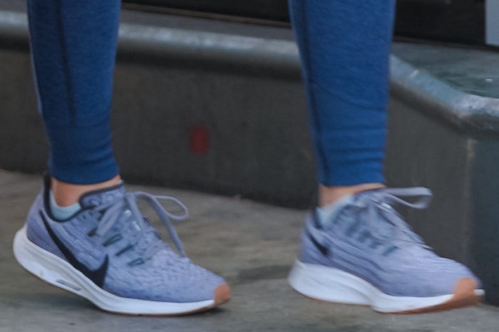 Lucy Hale grounds her off-duty athleisure look with Nike Air Zoom Pegasus 36 sneakers in Gunsmoke, choosing the lightweight running shoes for comfort and all-day Studio City errands