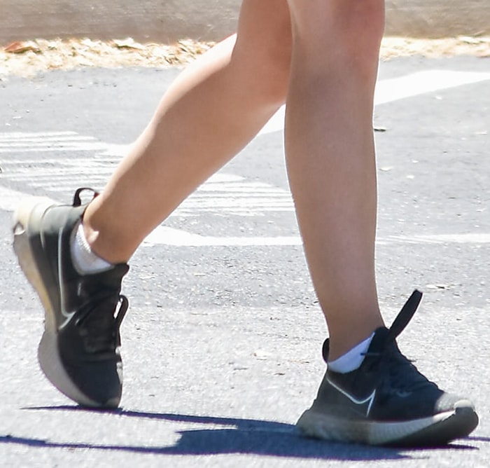 A closer look at Lucy Hale’s Nike Renew Run sneakers reveals breathable mesh uppers, cushioned midsoles, and flexible rubber soles designed for walking, light training, and all-day comfort