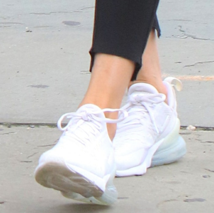 A closer look at Olivia Palermo's white Nike Air Max 270 sneakers worn with black cropped sweatpants