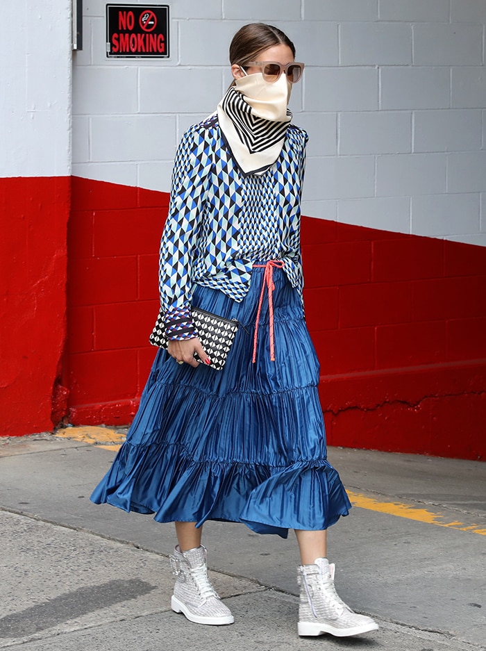 Olivia Palermo adds a patterned black-and-white purse to her blue outfit