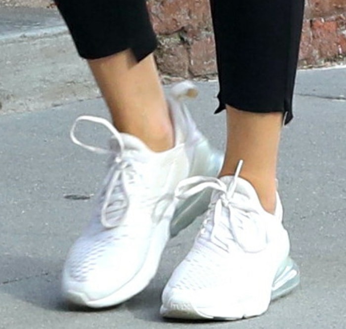 A closer look at Olivia Palermo's white Nike Air Max 270 sneakers paired with cropped black joggers