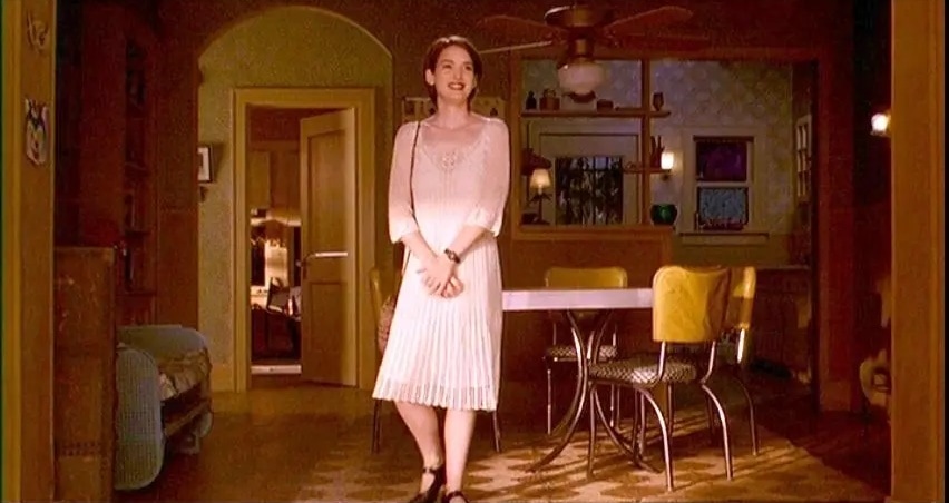 Winona Ryder channels effortless '90s grunge-meets-romance in Reality Bites, wearing an off-white crochet dress paired with black Mary Jane heels for a look that’s both youthful and quietly rebellious