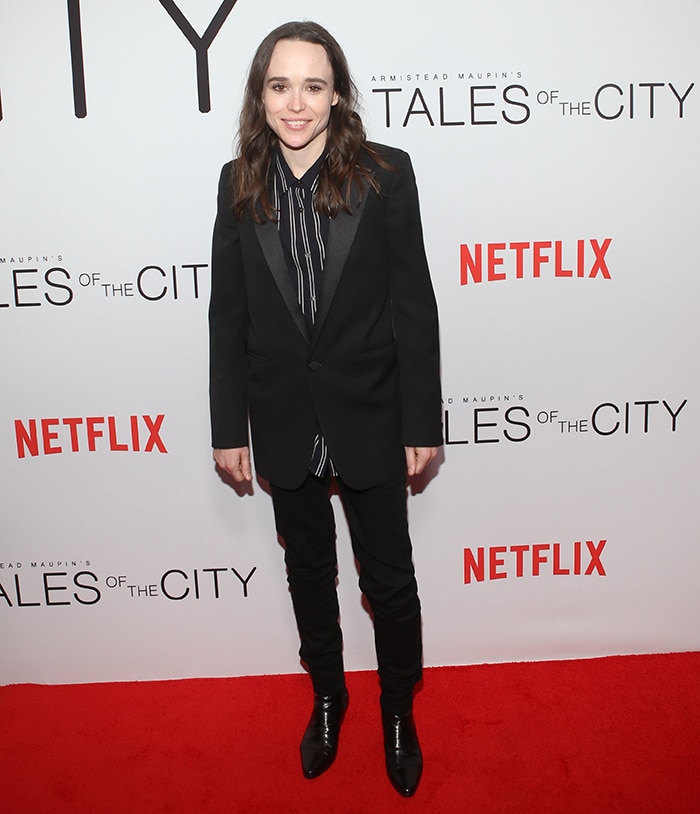 Elliot Page opts for sleek minimalism in a tailored black suit paired with pointed black leather boots at the Tales of the City New York premiere at The Metrograph