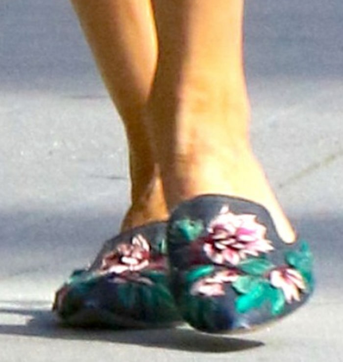 Palermo finishes the outfit in Alberta Ferretti Mia velvet mules, detailed with colorful floral embroidery, pointed toes, and low stacked heels