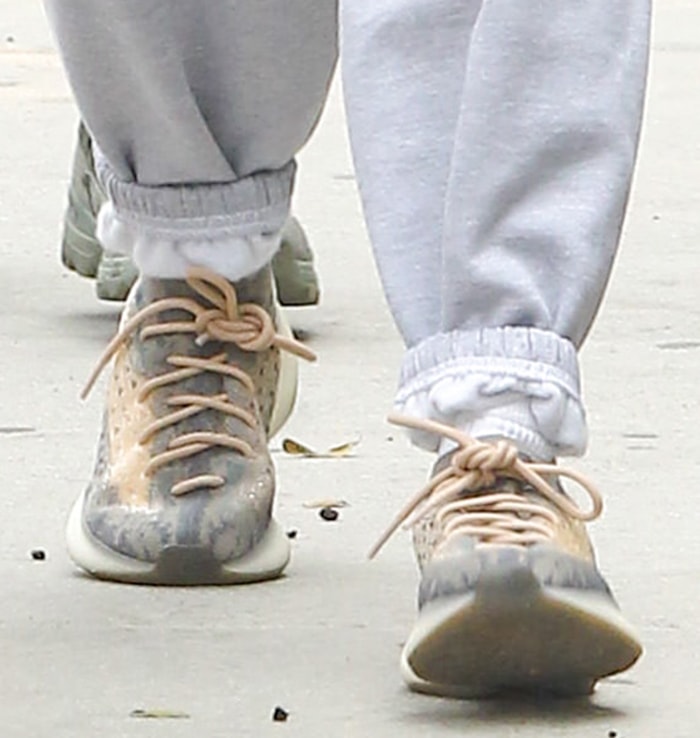 The Adidas Yeezy Boost 380 "Mist" sneakers stood out with their woven gray-and-tan Primeknit upper, sculpted sole, and distinctive rope laces that became signatures of the silhouette's futuristic design