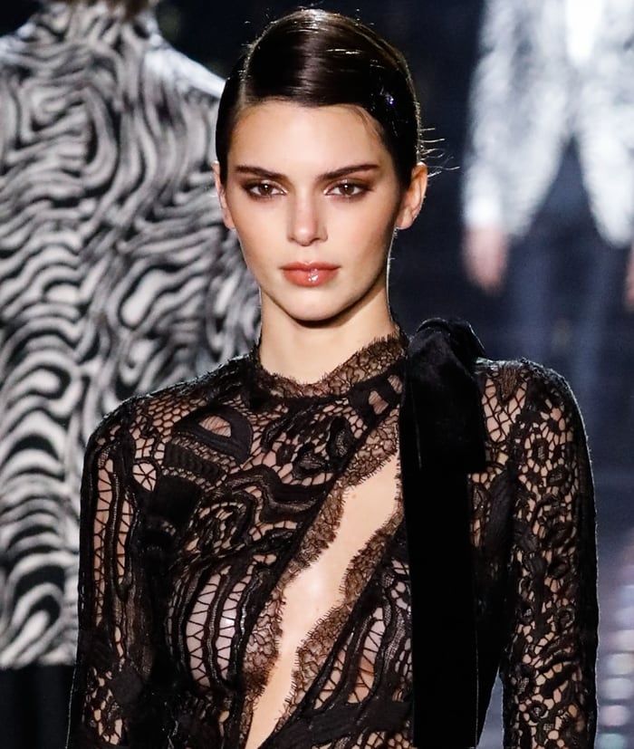 Kendall Jenner captivates on the runway in a daring black lace dress at the Tom Ford: Autumn/Winter 2020 Fashion Show