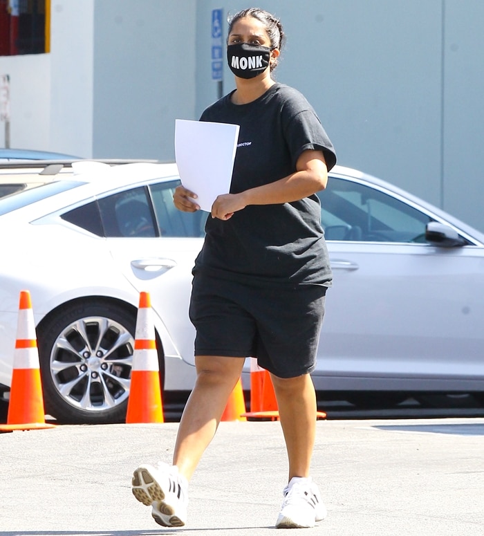 Lilly Singh keeps it casual in an all-black outfit with Adidas sneakers and a "Monk" mask while out in Los Angeles