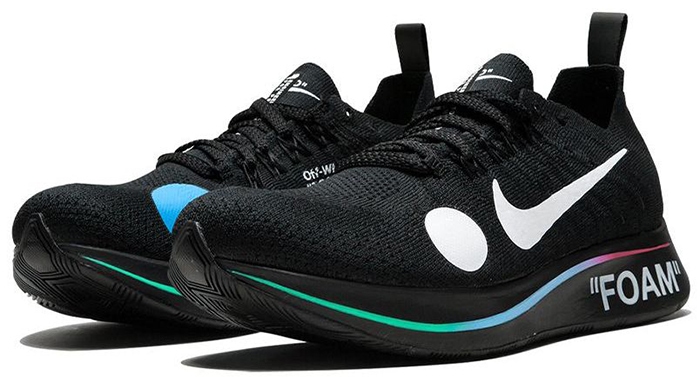 The black Off-White x Nike Zoom Fly Mercurial sneakers fused football-inspired detailing with performance running technology, featuring Flyknit uppers, oversized graphic dots, gradient “FOAM” midsoles, and Virgil Abloh’s signature industrial-style branding for a futuristic take on athletic footwear