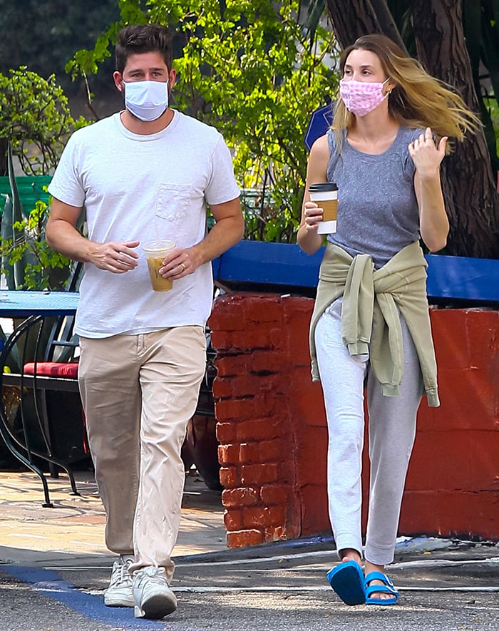 Whitney Port wears blue Birkenstock Arizona EVA sandals with gray sweatpants while getting coffee with Tim Rosenman in Los Angeles