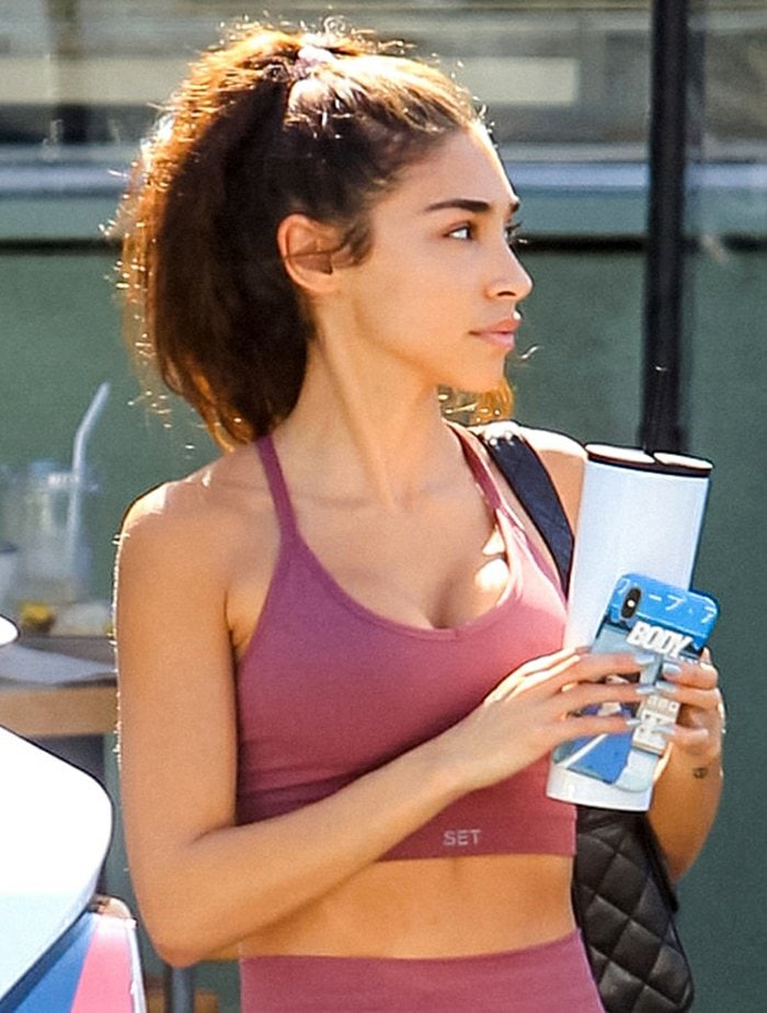 Chantel Jeffries wore her hair in a high ponytail and kept accessories minimal, letting the dusty-rose Set Active sports bra and matching leggings define the clean, sporty look