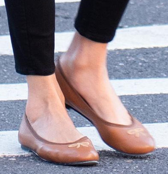 Nicky Hilton completes her errands look with her signature French Sole “Kathy” ballet flats, featuring a soft leather finish and delicate embroidered bow that adds understated polish to her everyday style