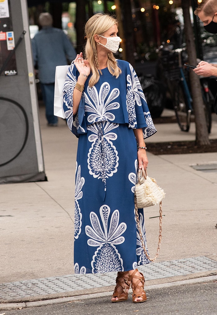 Nicky Hilton steps out in SoHo on October 1, 2020, wearing La DoubleJ’s blue “Bain Douche” maxi dress, styled with a woven top-handle bag and strappy brown heeled sandals that add structure to the flowing silhouette